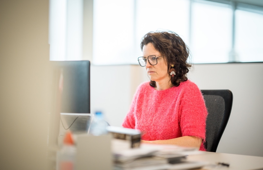 Emma working at a desk